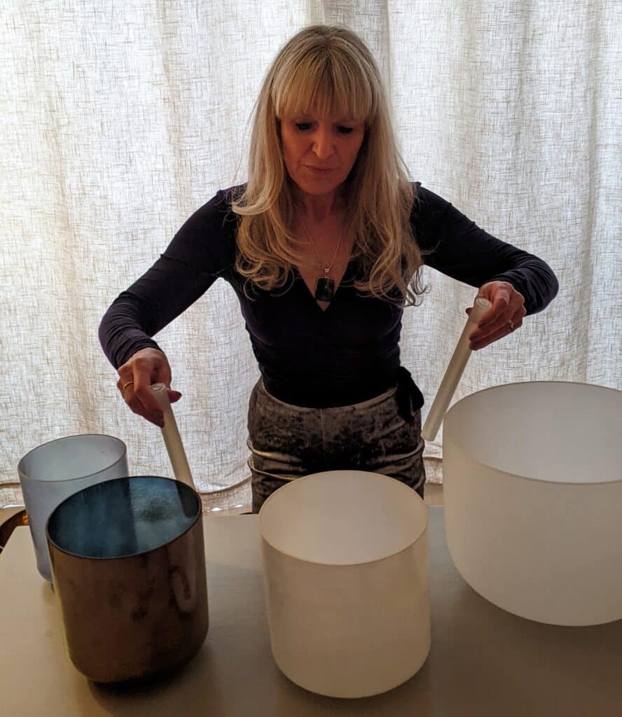Alison Taylor-Smith with sound bowls at home.